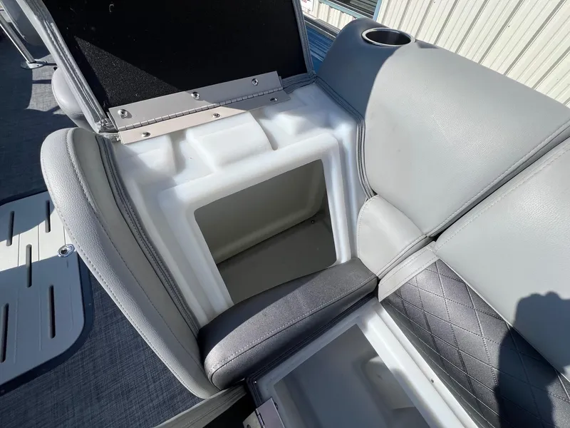 Slide: The Image of 2019 Misty Harbor 2285 Biscayne Bay CU boat seat with open storage compartment. - 12