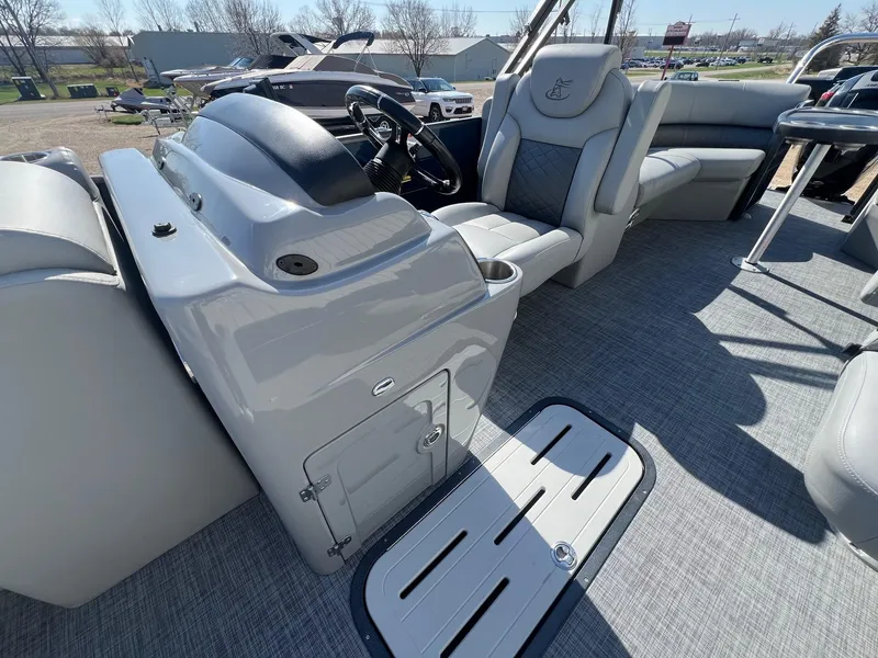 Slide: The Image of 2019 Misty Harbor 2285 Biscayne Bay CU pontoon boat interior with helm and seating. - 13