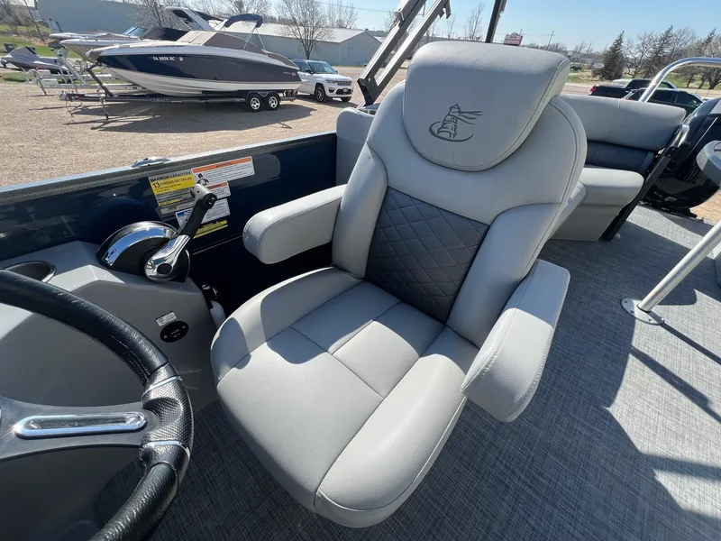 Slide: The Image of Captain's chair on 2019 Misty Harbor 2285 Biscayne Bay CU pontoon boat, with control panel. - 14