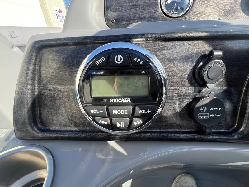 Slide: The Image of Boat dashboard featuring Kicker audio system and USB input on 2019 Misty Harbor 2285 Biscayne Bay CU. - 17