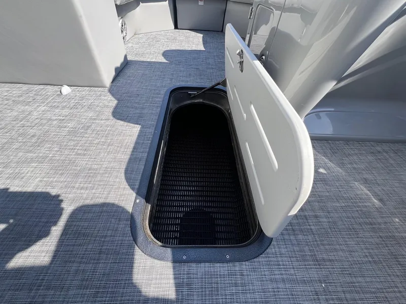 Slide: The Image of Open storage compartment on 2019 Misty Harbor 2285 Biscayne Bay CU boat deck. - 19