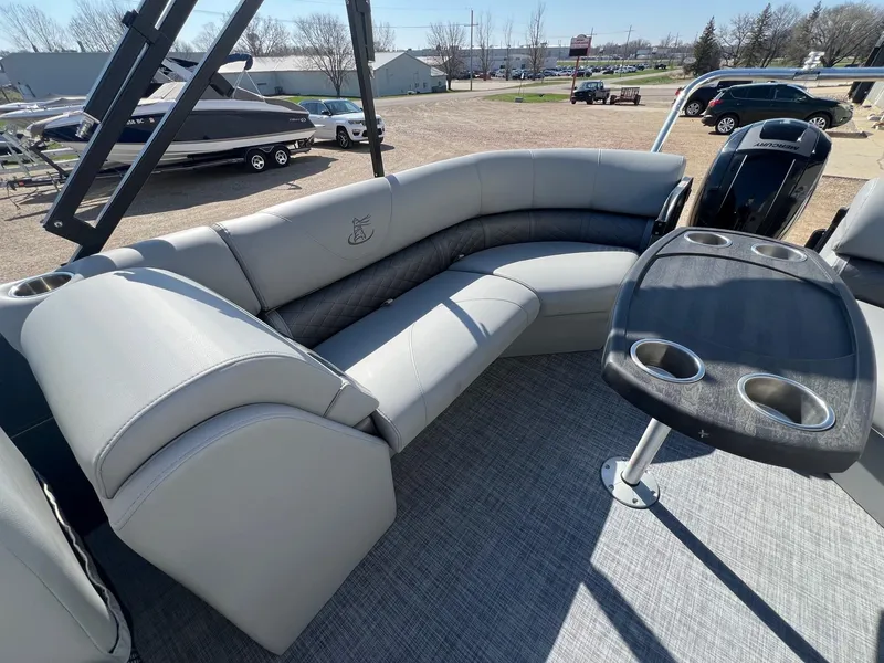 Slide: The Image of 2019 Misty Harbor 2285 Biscayne Bay CU pontoon boat with gray seating and table. - 20