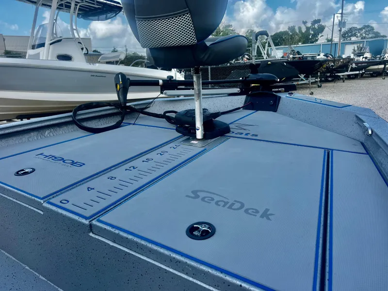 Slide: The Image of 2023 Xpress H190B boat deck with SeaDek flooring and measuring guide. - 7