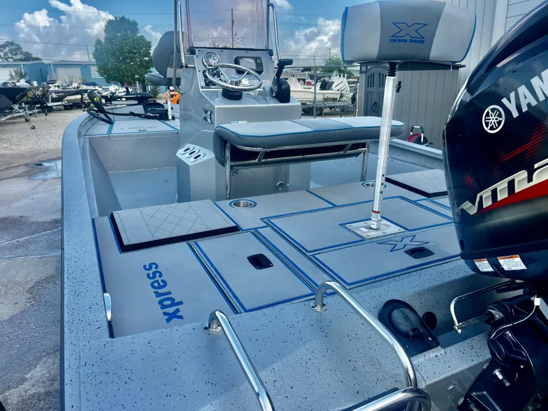 Slide: The Image of 2023 Xpress H190B boat with Yamaha engine, featuring spacious deck and modern controls. - 8