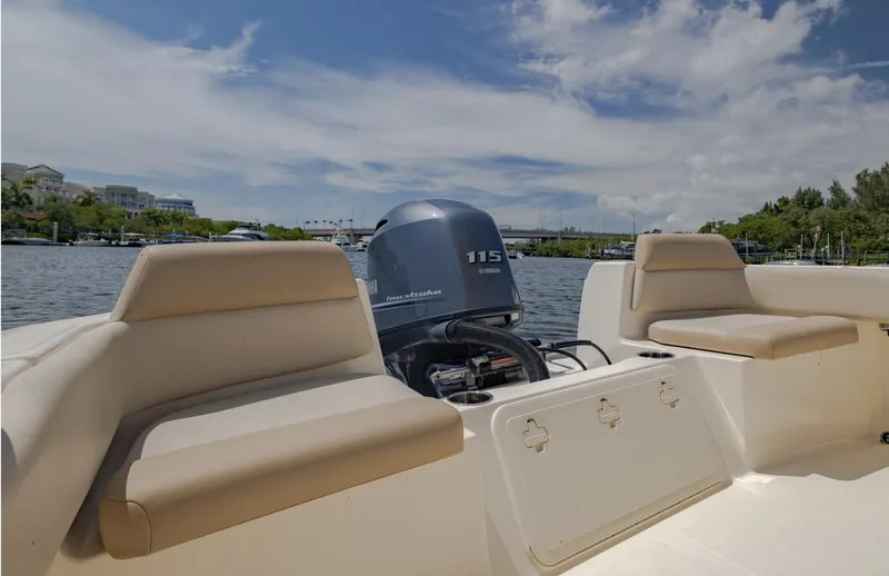 Slide: The Image of 2023 Scout 195 Sportfish boat with Yamaha 115 engine on a sunny day. - 9