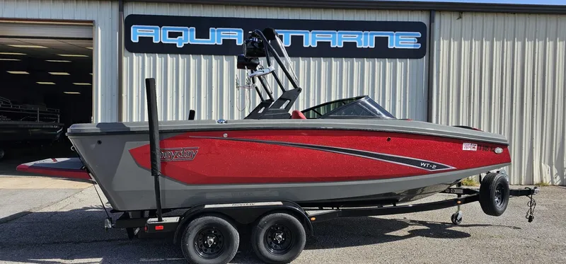 Slide: The Image of 2020 Heyday WT-2DC boat in red and gray on a trailer outside Aqua Marine. - 2