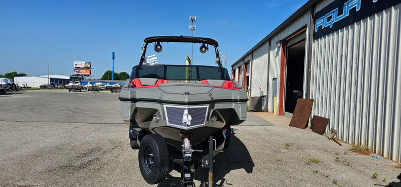 Slide: The Image of 2020 Heyday WT-2DC boat on trailer outside a warehouse under clear blue sky. - 3