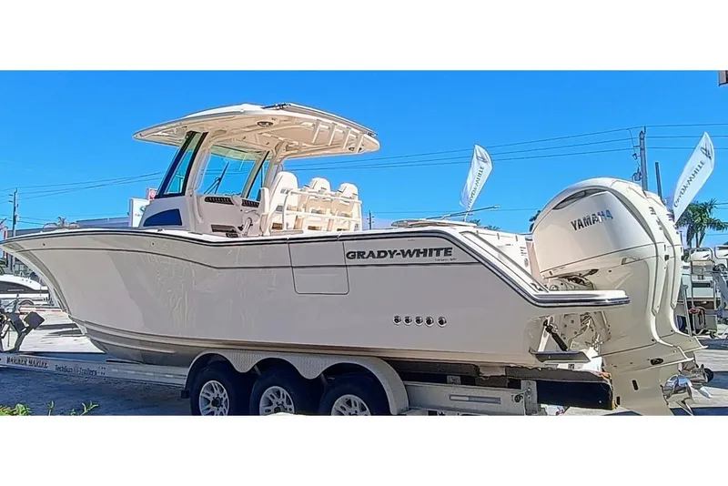 Slide: The Image of 2025 Grady-White Canyon 326 boat with Yamaha engines on a trailer. - 3