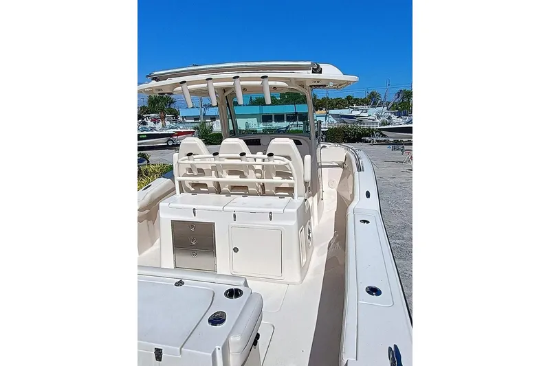 Slide: The Image of 2025 Grady-White Canyon 326 boat, spacious deck, modern design, clear blue sky background. - 5