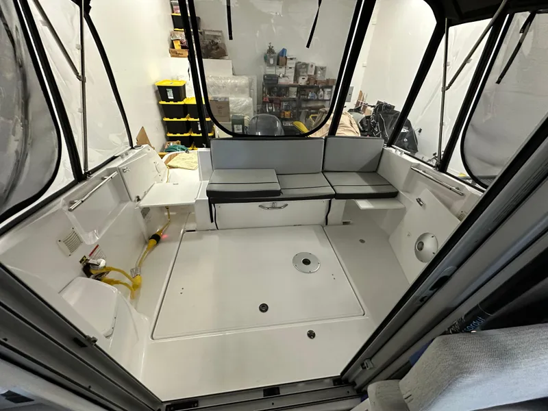 Slide: The Image of 2022 Jeanneau NC 795 boat interior with seating and storage compartments. - 20