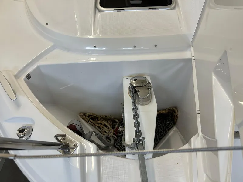 Slide: The Image of Anchor compartment of 2022 Jeanneau NC 795 boat with chain and rope. - 26