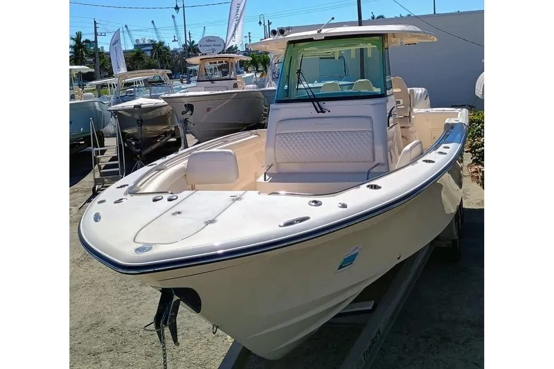 The Image of 2025 Grady-White Canyon 326 boat displayed outdoors, showcasing sleek design and spacious deck. - 0