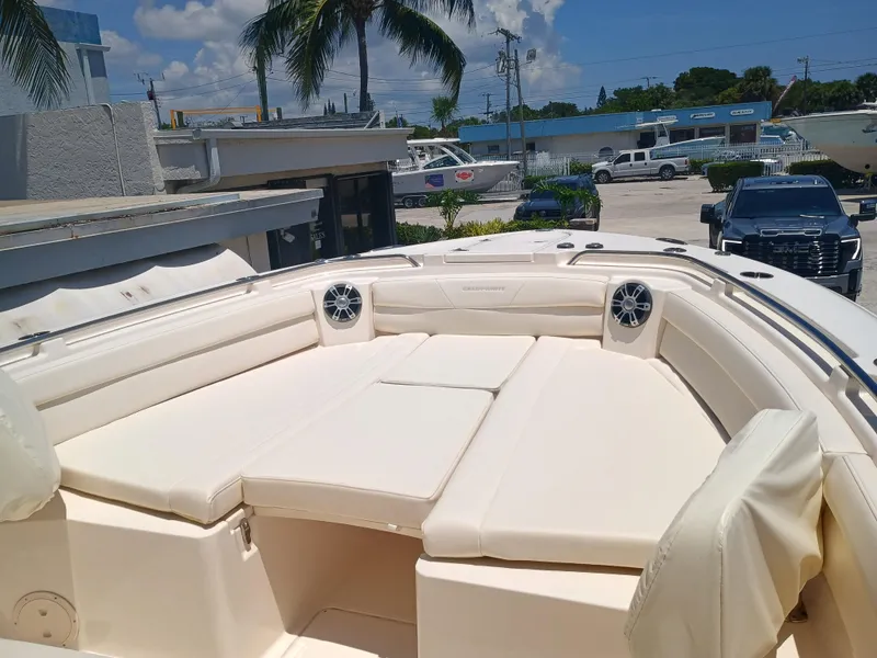 Slide: The Image of 2025 Grady-White Canyon 326 boat with spacious seating and modern design. - 7