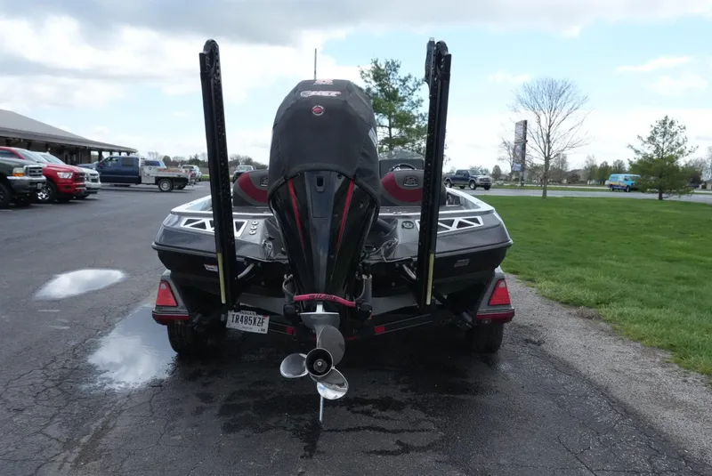 Slide: The Image of 2018 Ranger Z520L boat rear view with motor and propeller on pavement. - 10