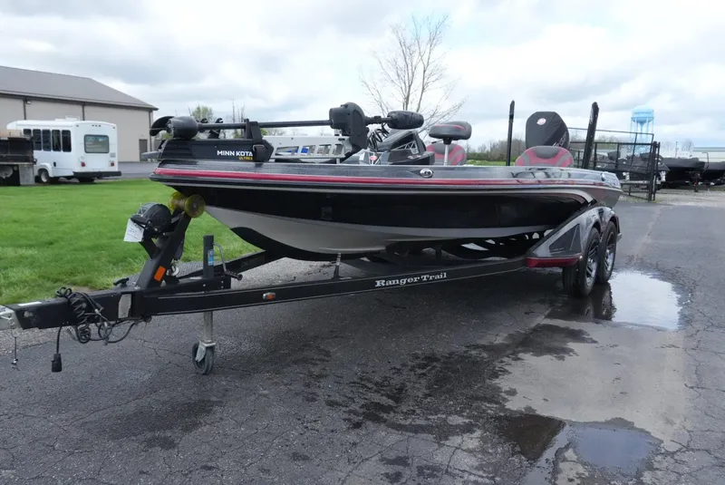Slide: The Image of 2018 Ranger Z520L boat on trailer, parked outdoors on wet pavement. - 2