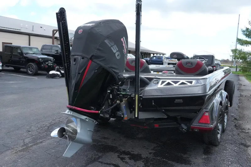 Slide: The Image of 2018 Ranger Z520L boat with powerful outboard motor in a parking lot. - 9