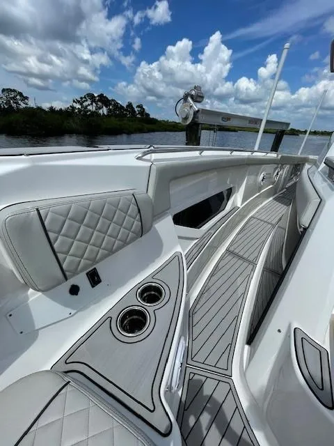 Slide: The Image of 2023 Pursuit S 378 Sport boat interior with sleek seating and cup holders. - 14