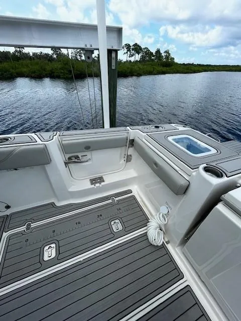 Slide: The Image of 2023 Pursuit S 378 Sport boat deck with water view and clear skies. - 7