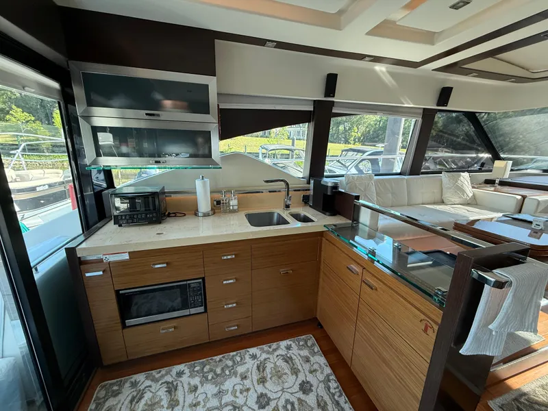 Slide: The Image of Luxurious kitchen interior of 2016 Tiara Yachts 50 Coupe with modern appliances and sleek design. - 14