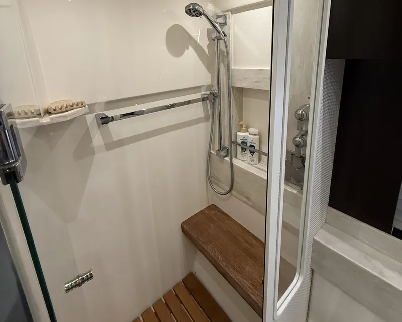 Slide: The Image of Luxurious bathroom in 2016 Tiara Yachts 50 Coupe, featuring modern fixtures and elegant design. - 24