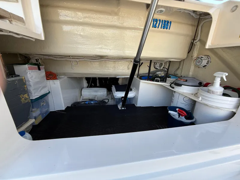 Slide: The Image of 2016 Tiara Yachts 50 Coupe storage compartment with equipment and supplies. - 30