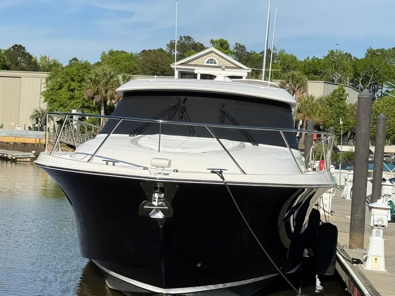Slide: The Image of 2016 Tiara Yachts 50 Coupe docked at marina, front view. - 4