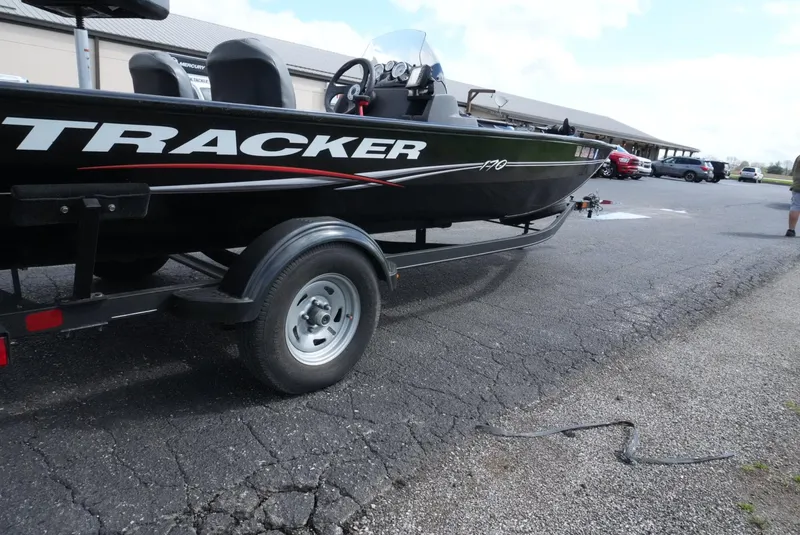 Slide: The Image of 2023 Tracker Pro 170 boat on trailer in parking lot. - 10