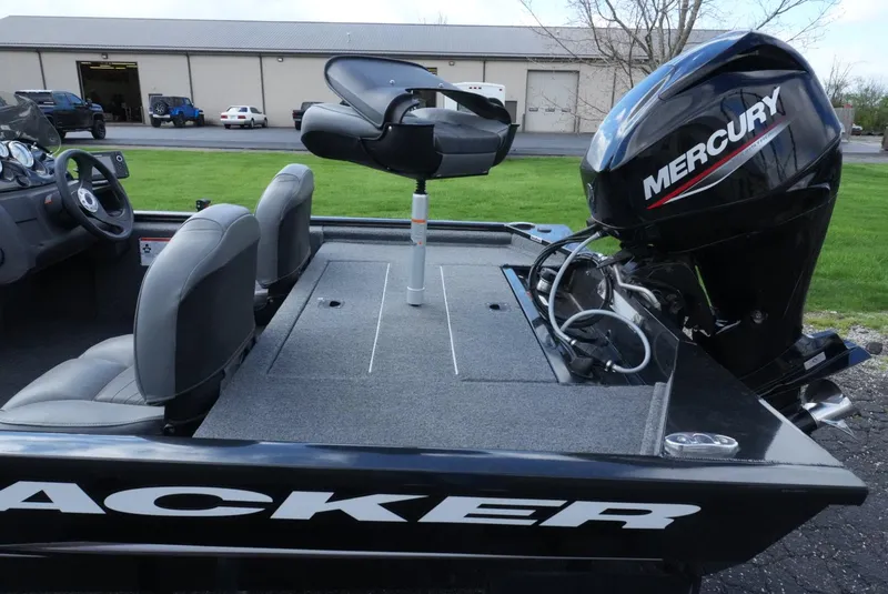 Slide: The Image of 2023 Tracker Pro 170 boat with Mercury engine, featuring seating and spacious deck. - 14