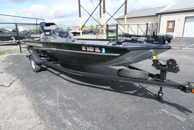 Slide: The Image of 2023 Tracker Pro 170 boat on trailer in parking lot, side view. - 4