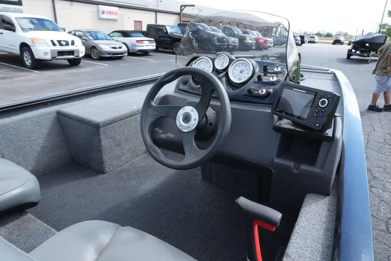 Slide: The Image of 2023 Tracker Pro 170 boat interior with steering wheel and dashboard controls. - 9