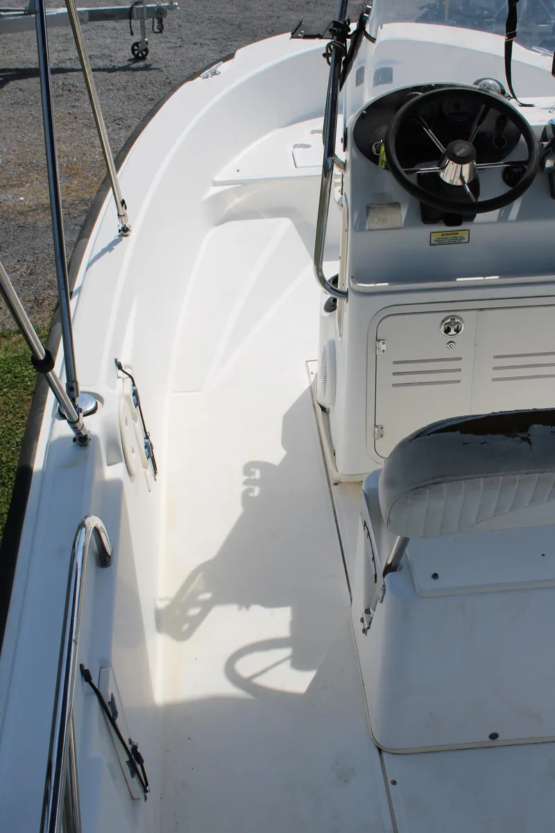 Slide: The Image of 2005 Boston Whaler 180 Dauntless boat interior with steering console and seating. - 10