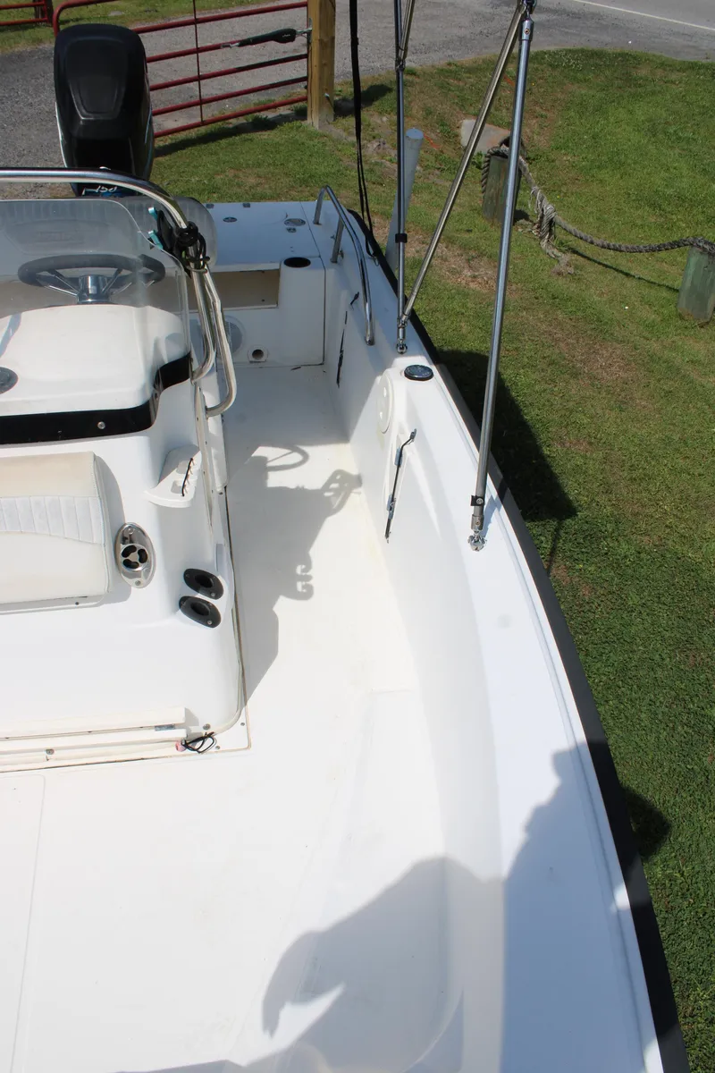 Slide: The Image of 2005 Boston Whaler 180 Dauntless boat deck with seating and steering console. - 14