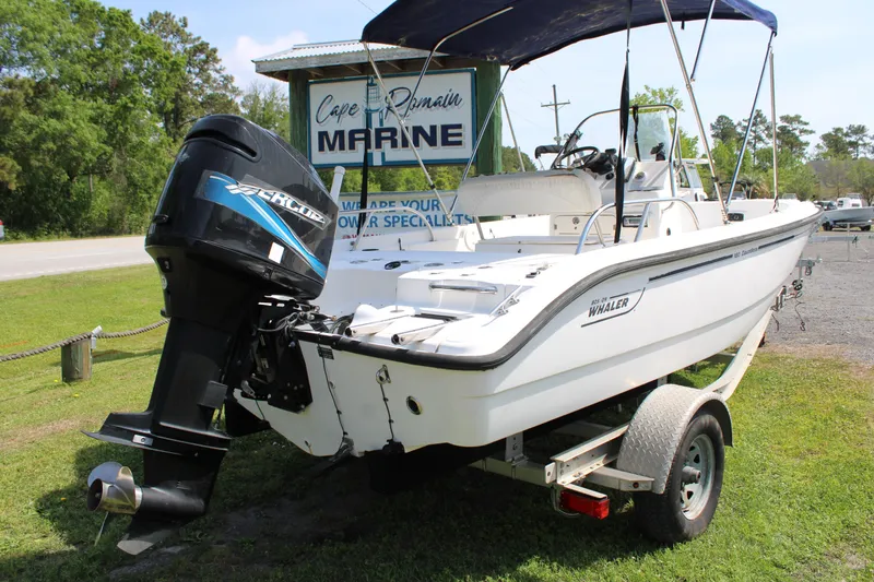 Slide: The Image of 2005 Boston Whaler 180 Dauntless boat on trailer with Mercury outboard motor. - 2