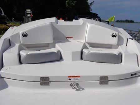 Slide: The Image of 2016 Scarab 165G boat interior with white seating and Rotax engine. - 11