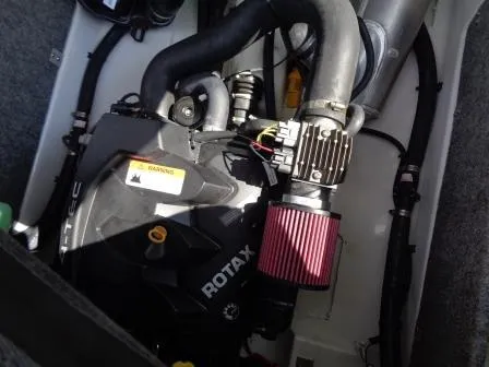 Slide: The Image of Engine compartment of a 2016 Scarab 165G with Rotax engine components. - 13