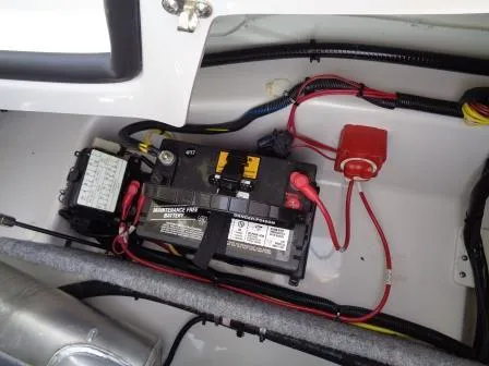 Slide: The Image of Battery compartment of a 2016 Scarab 165G boat with wiring and fuse box. - 15