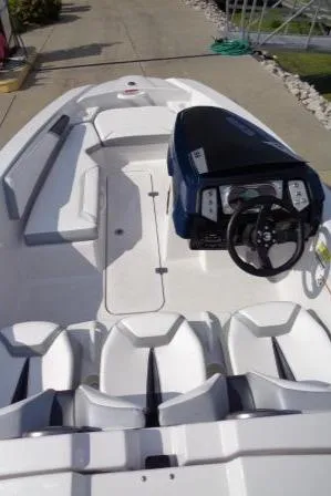 Slide: The Image of 2016 Scarab 165G boat interior with seating and steering console. - 18