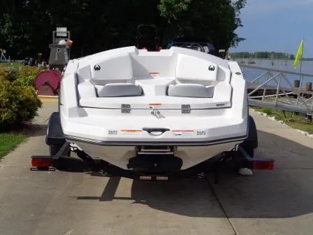 Slide: The Image of 2016 Scarab 165G boat on trailer by a lakeside dock. - 4