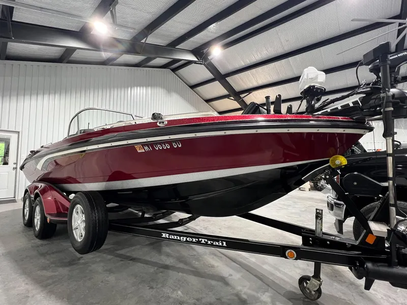 Slide: The Image of 2015 Ranger 620FS Fisherman boat on trailer in a garage setting. - 2