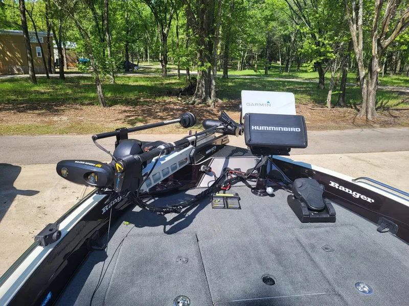 Slide: The Image of 2015 Ranger 620FS Fisherman boat with Humminbird electronics, parked in a wooded area. - 4