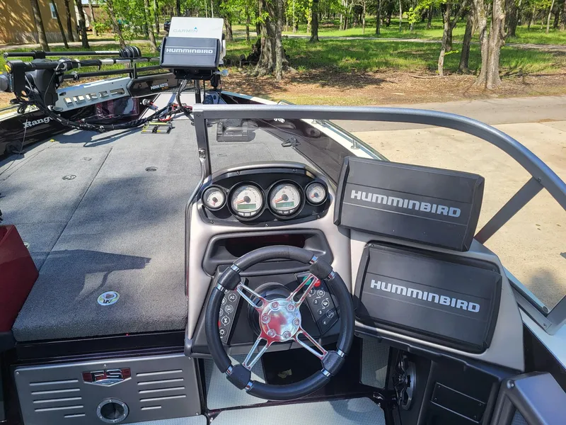 Slide: The Image of 2015 Ranger 620FS Fisherman boat dashboard with Humminbird electronics and steering wheel. - 5