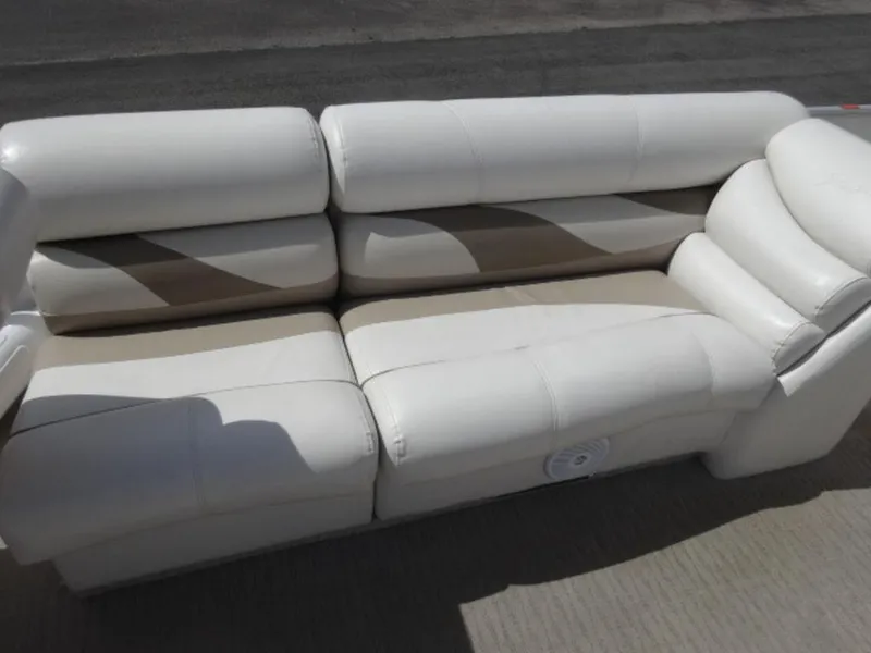 Slide: The Image of White leather boat seat from a 2008 Crest III XRS, shown outdoors. - 7