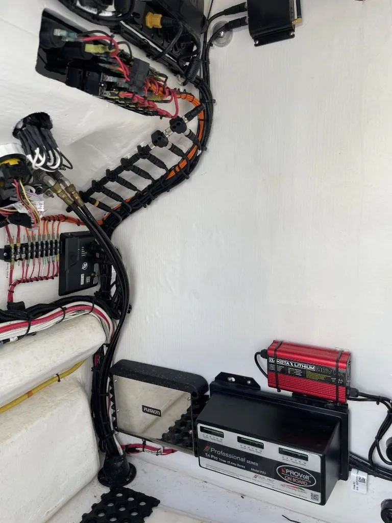 Slide: The Image of 2024 Reef Runner 230 XO boat electrical system with wiring and components. - 30