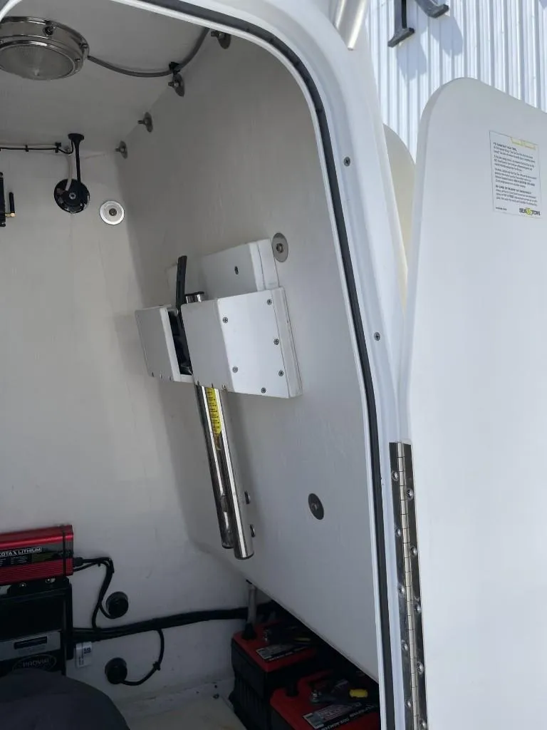 Slide: The Image of Interior view of 2024 Reef Runner 230 XO boat, showcasing equipment and storage area. - 35