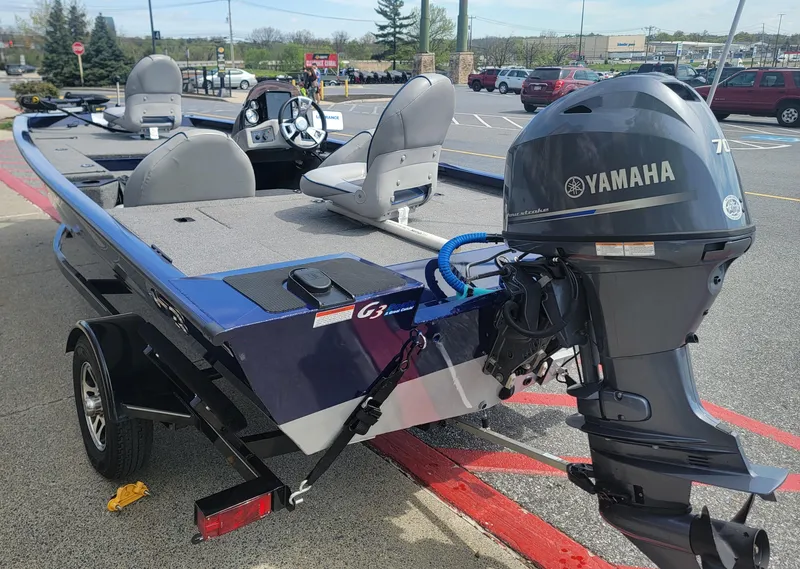 Slide: The Image of 2018 G3 Sportsman 17 boat with Yamaha motor in parking lot. - 2
