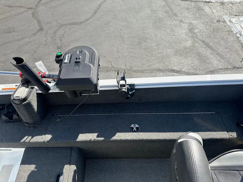 Slide: The Image of 2011 Lund 1625 Rebel XL Sport boat interior with mounted equipment and seating. - 14