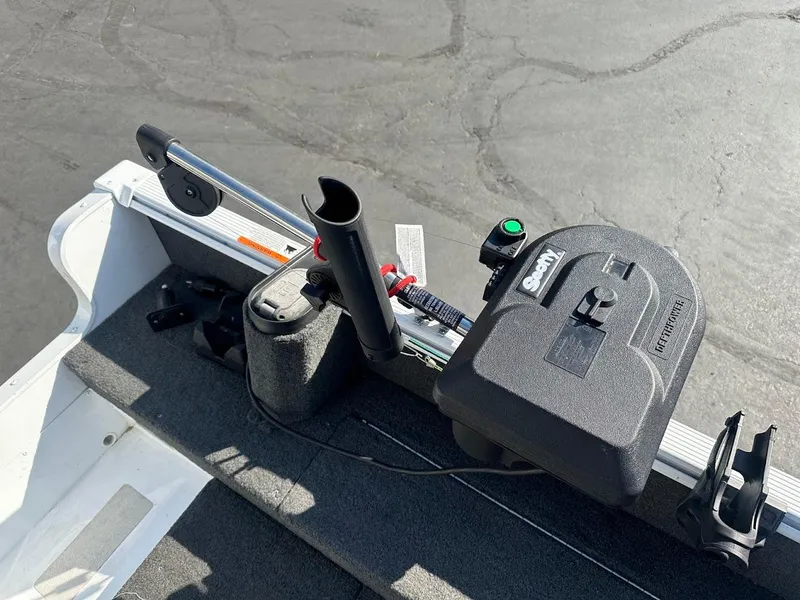 Slide: The Image of 2011 Lund 1625 Rebel XL Sport boat with trolling motor and control panel. - 16