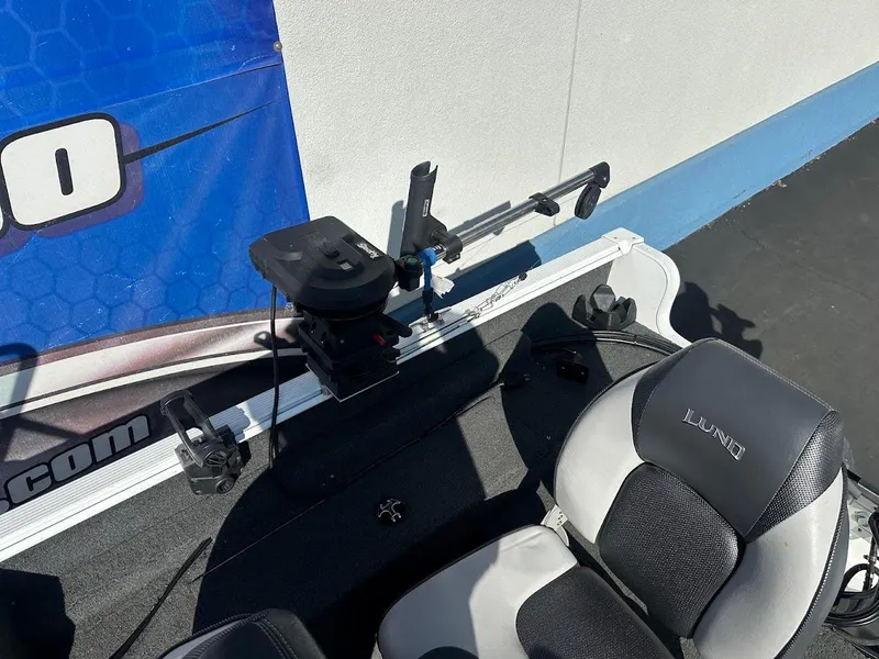 Slide: The Image of 2011 Lund 1625 Rebel XL Sport boat interior with fishing equipment and seating. - 20