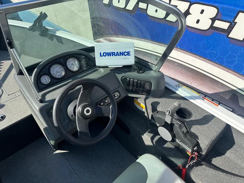Slide: The Image of 2011 Lund 1625 Rebel XL Sport boat dashboard with Lowrance equipment. - 25