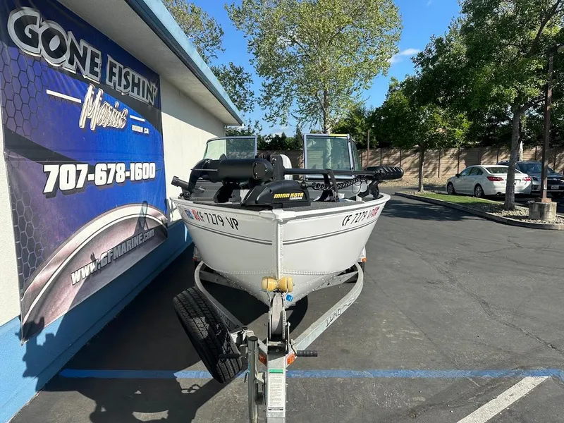 Slide: The Image of 2011 Lund 1625 Rebel XL Sport boat on trailer outside Gone Fishin' Marine. - 3